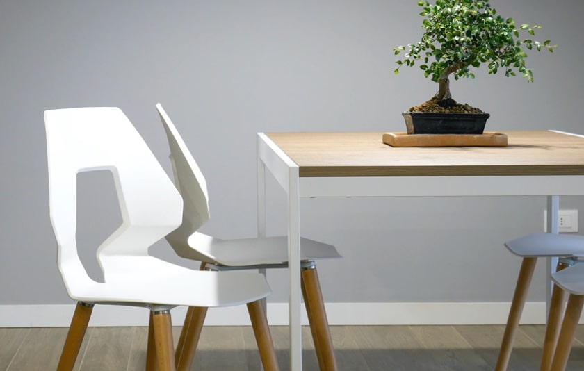 image of a table with 4 white chairs